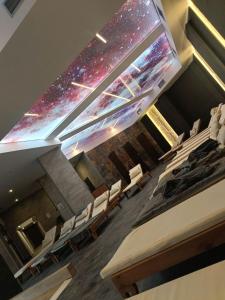 an empty auditorium with a projection of the universe at Lola apartman Residence Hill in Kopaonik