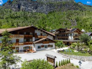 a resort with a mountain in the background at Leres Pastry Hotel in Sottoguda
