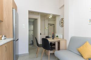 a living room with a table and a chair at Rania's Seaside Nest- Steps from the Beach in Kiaton