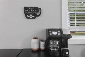 a coffee maker sitting on top of a counter at Olathe corporate retreat in Olathe