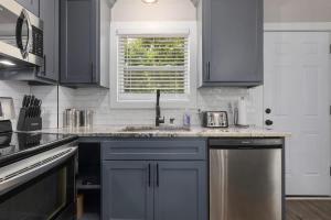 a kitchen with a sink and a window at Olathe corporate retreat in Olathe +10 photos