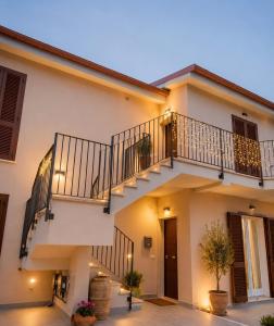 a house with a staircase in front of it at La Casa nella Contea in Terni