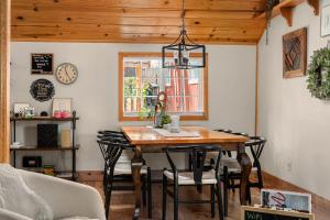 a dining room with a table and chairs at Aery Pines in Wrightwood