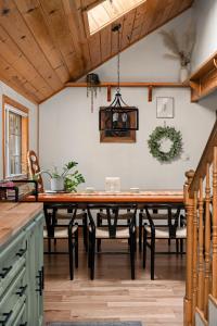 a dining room with a large wooden table and chairs at Aery Pines in Wrightwood