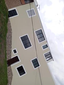 a building with windows on the side of it at Apartamentos Latacunga in Latacunga +4 photos