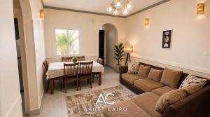 a living room with a couch and a table at Akhet Cairo Suites in Cairo