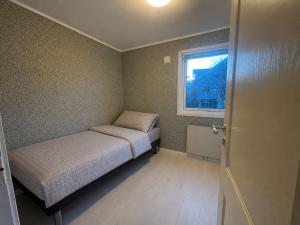 a small bedroom with two beds and a window at Best place to live in Trondheim