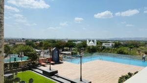 a view of a swimming pool on top of a building at Hotel Express Inn Heritage Aurangabad Airport in Aurangabad
