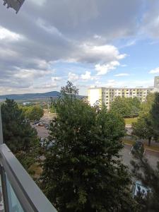 a view of a parking lot and a building at 1-room apartment in Nitra