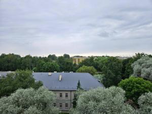 an overhead view of a building with trees in the background at Royal View Apartment in Liepāja