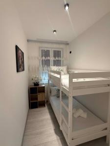 a bedroom with two bunk beds and a window at B&B Legnago in Legnago