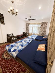 a bedroom with a large bed in a room at Sultan Homestay in Srinagar