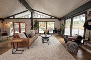 a living room with a couch and a table at Trailhead Lodge in Bend