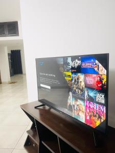 a flat screen tv sitting on top of a table at Elegant Residence Guest House in Dhaka