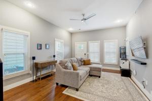 a living room with a couch and a table at Wander Bentonville in Bentonville