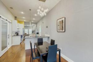 a kitchen and dining room with a table and chairs at Wander Bentonville in Bentonville