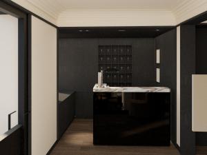 a kitchen with black walls and a white counter top at Hôtel Atlas in Paris