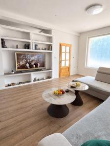 a living room with a couch and a table at Casa Mia in Višići