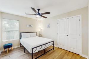 a bedroom with a bed and a ceiling fan at Emerald Escape in Corpus Christi