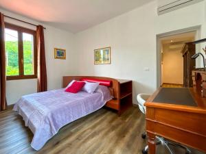 a bedroom with a bed and a dresser and a piano at Ramoscello in Altare
