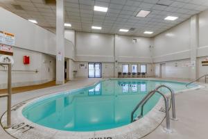 a large swimming pool with blue water in a building at Pinnacle 2101 in Beech Mountain