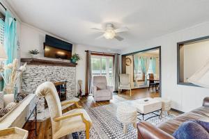a living room with a couch and a fireplace at Pinnacle 2101 in Beech Mountain