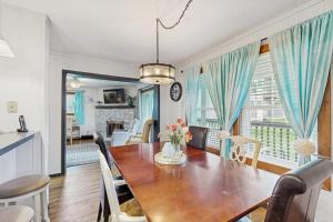 a dining room and living room with a table and chairs at Pinnacle 2101 in Beech Mountain