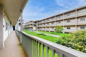 a balcony of an apartment building with a yard at Pinnacle 2101 in Beech Mountain