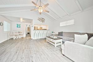 a living room with a couch and a table at Balboa Duplex in Newport Beach