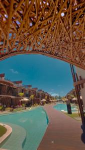 a view of a swimming pool at a resort at NAAY - Nature 106 in Pôrto de Pedras