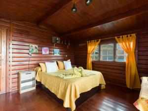 a bedroom with a bed in a wooden room at La Maxada Luz Maria in El Cotillo +35 photos