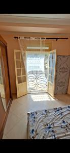 a bedroom with a window and a bed in a room at اولاد بونار in Jijel