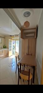 a kitchen with a table and chairs in a room at اولاد بونار in Jijel +2 photos
