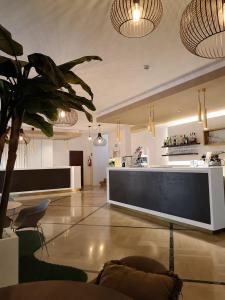 a lobby with a large screen in the middle of a room at Hotel La Fenice in Lido di Jesolo