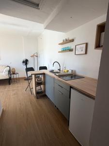 a kitchen with a sink and a counter top at Atalaya Green Nest in Estepona