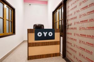 a sign that says oxo in front of a door at SPOT ON ROYAL KING HOTEL in Lucknow