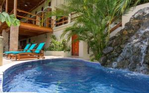 a swimming pool in the middle of a house at Casa Pura Paz in Puntarenas