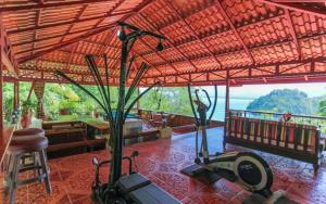 a living room with a view of the ocean at Casa Pura Paz in Puntarenas