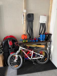 a bike parked in a room with a wall at Alpine Chic Escape with Spa & Panoramic Views in Engelberg
