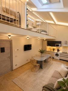 a living room with a couch and a table at Galeo Suites in Florence