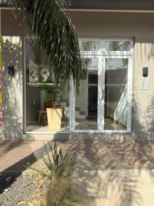 a house with a large window on the side of it at Olivia apart in Chajarí