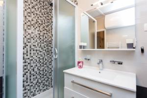 a bathroom with a sink and a shower at Guesthouse Ivona in Dubrovnik +79 photos