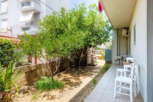 a small tree on the side of a building at Arivaro Apartment in Souda