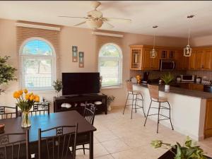 a kitchen and living room with a table and chairs at Ocean View Serenity in Cupecoy