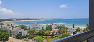 a view of a beach with buildings and the ocean at Seaview homestay on Third avenue beach apt- nyali in Mombasa