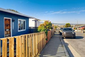 a truck parked on a sidewalk next to a house at Deep Blue Seaside in Monterey