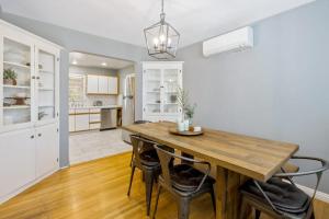 a kitchen and dining room with a wooden table and chairs at Victory On Vine in Paso Robles