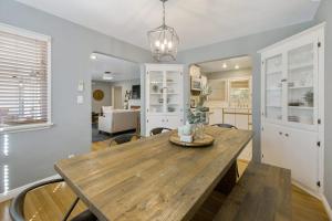 a kitchen and dining room with a wooden table at Victory On Vine in Paso Robles