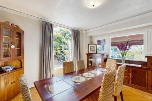 a dining room with a wooden table and chairs at Urban Ventura Oasis in Ventura