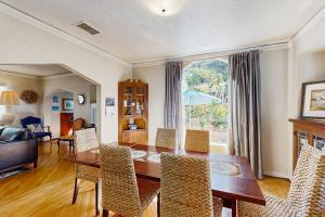 a living room with a dining room table and chairs at Urban Ventura Oasis in Ventura +22 photos
